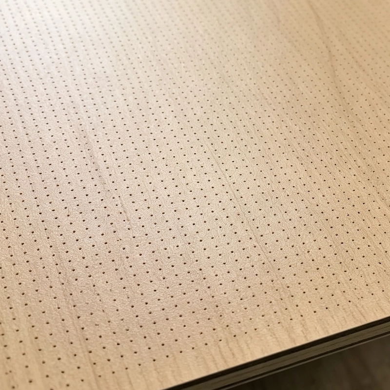 Close-up of micro-perforated aluminum panel, tiny round hole CNC punching detail, acoustic perforated metal panel for interior ceiling noise reduction