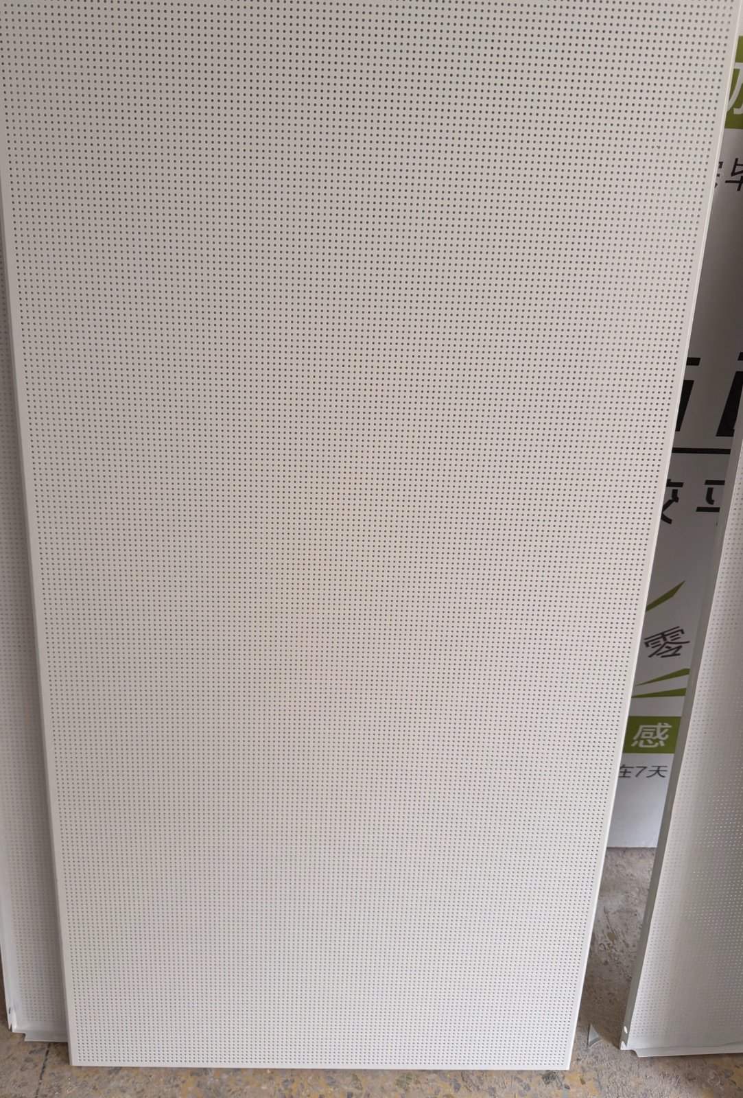 Micro-perforated aluminum acoustic ceiling panel on site at the Baiyun teaching-building retrofit