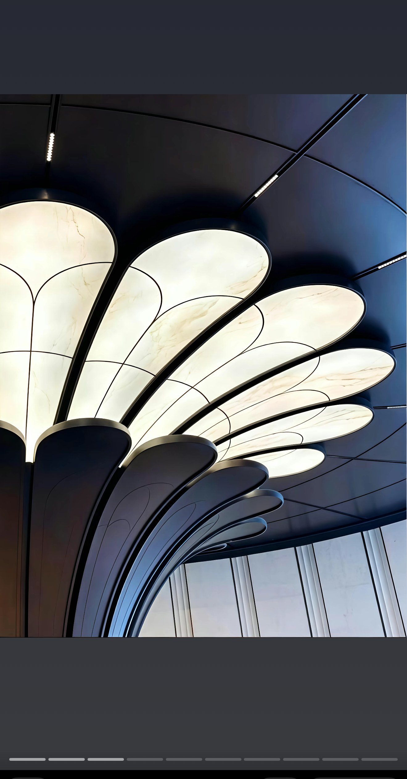 Looking up into the 16-petal backlit aluminum ceiling canopy