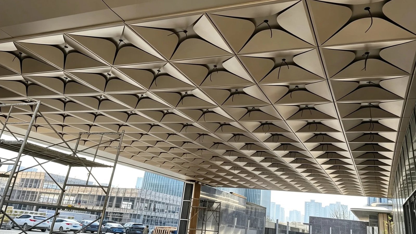 LINDELACR parametric 3D petal aluminum ceiling canopy split into unique CNC-formed metal panels