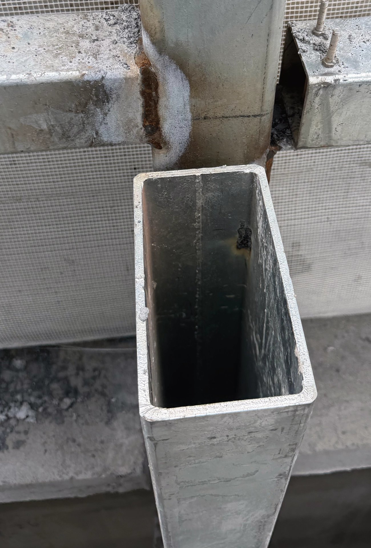 Welded rectangular hollow-section mullion and bracket bolts for the Zhaoqing CSG rainscreen grid