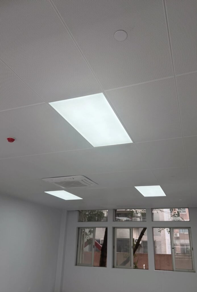 Guangzhou Baiyun University teaching room: LINDELACR micro-perforated metal ceiling with factory light trays and a cassette AC opening