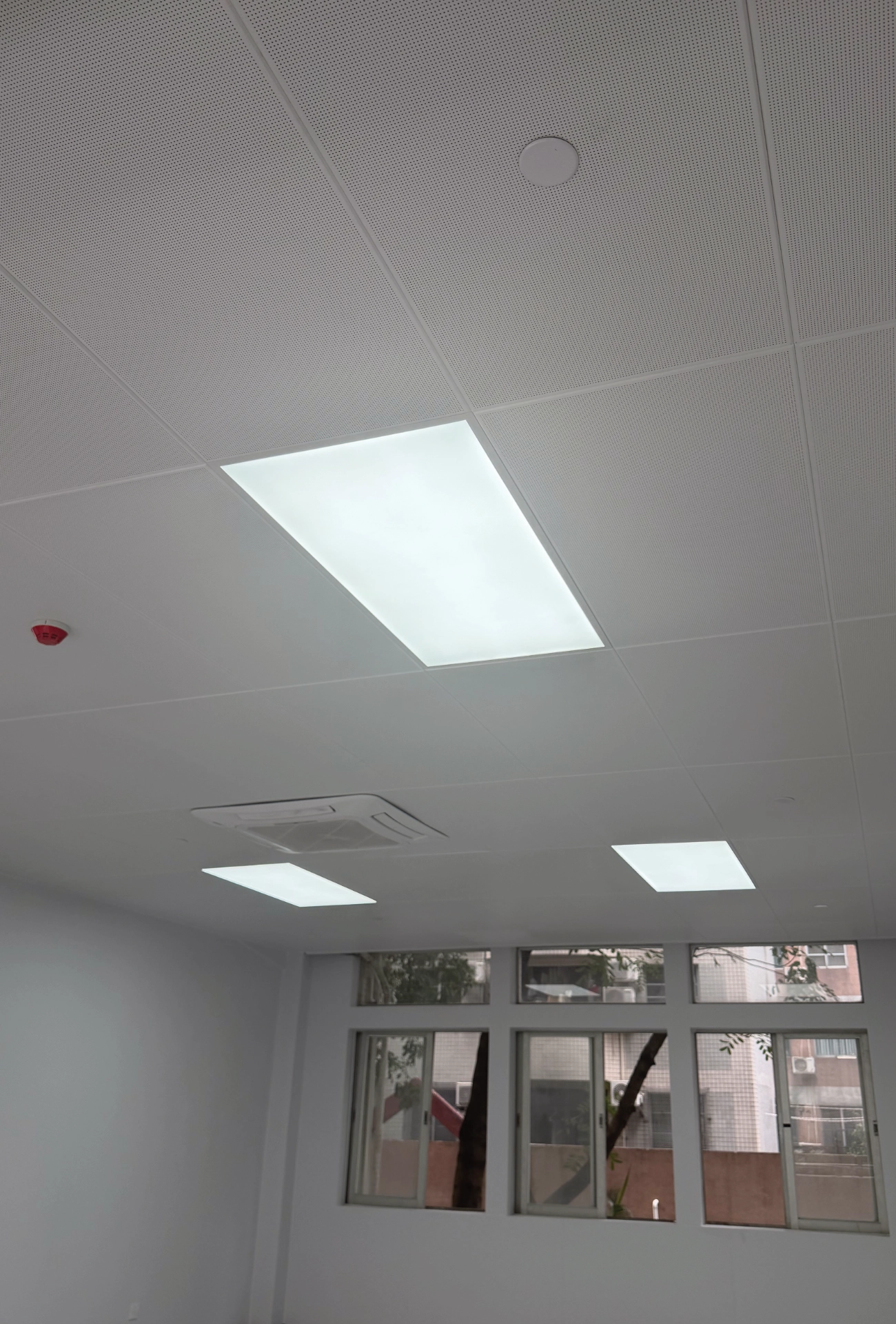 Guangzhou Baiyun University: LINDELACR micro-perforated aluminum ceiling with factory light trays and a cassette AC opening