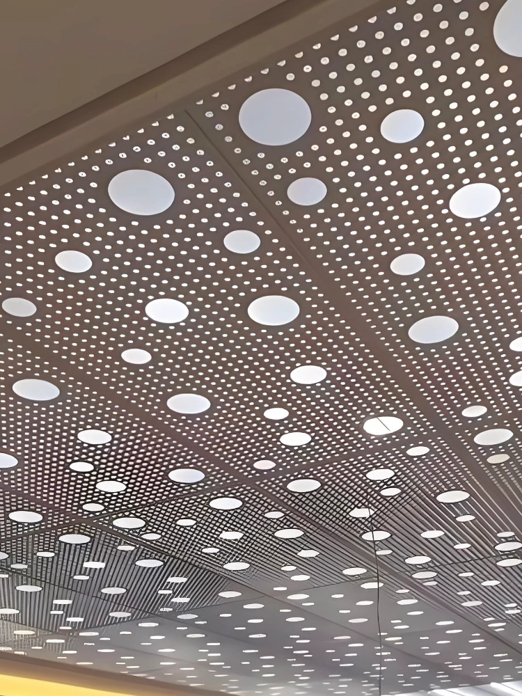 LINDELACR perforated aluminum drop ceiling with factory-cut circular downlights and a small-hole field on 0.6–0.8 mm coil
